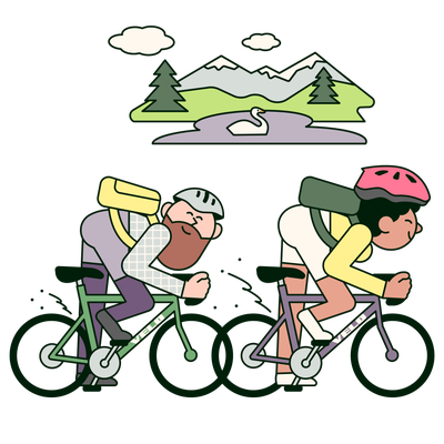 Two cyclists biking through the mountain