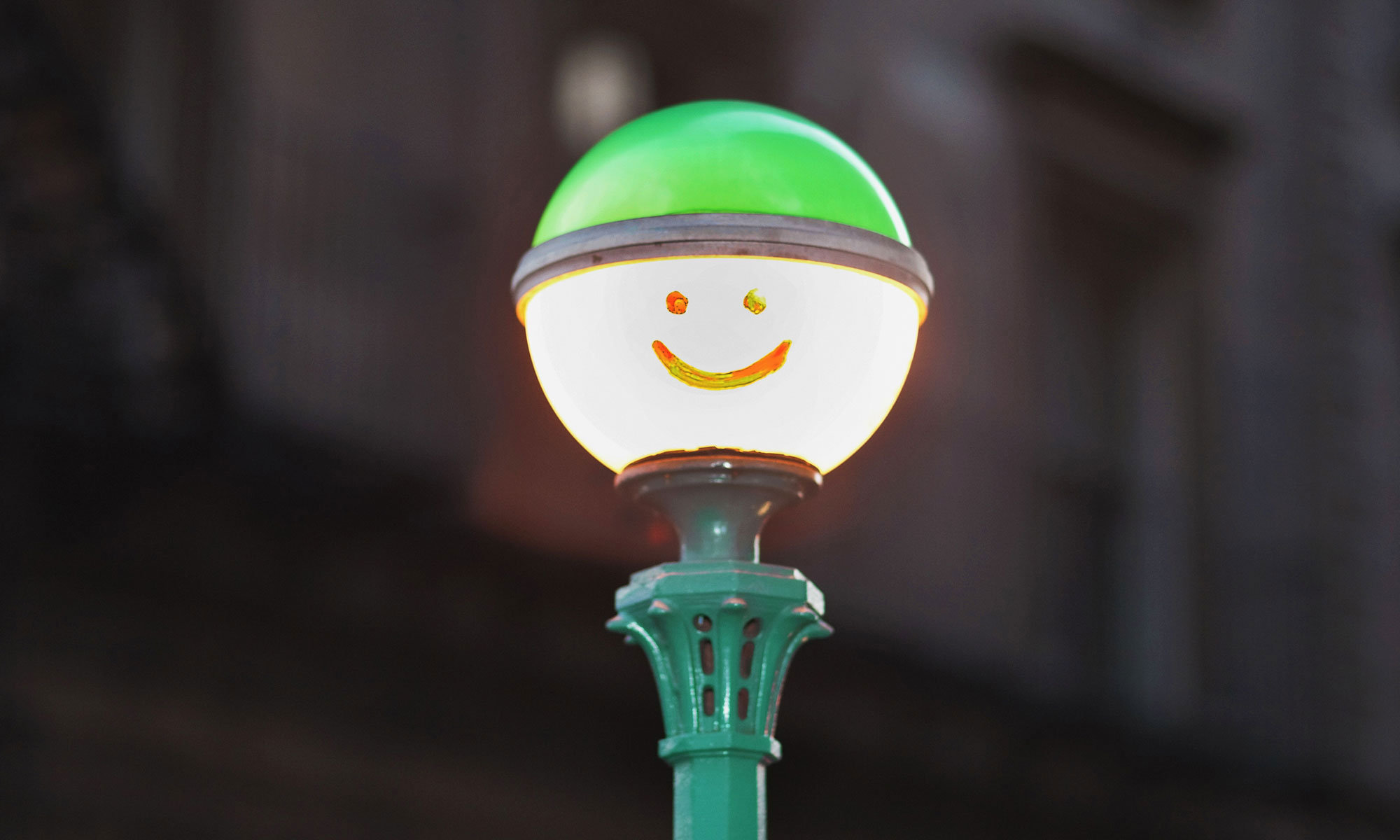 Lamp post with a drawn smily face